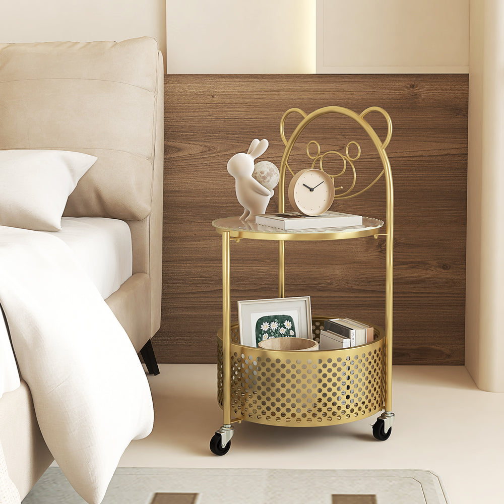 Gold modern side table with bear pattern and sturdy tempered glass top, featuring a round design for easy access and.