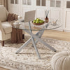 Round glass coffee table with a silver geometric metal frame, perfect for modern living spaces and easy maintenance.