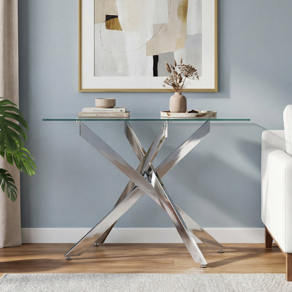 Modern glass console table with a clear tempered glass top and chrome legs, perfect for stylish entryway display.