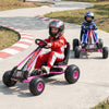 Kids riding pink go karts with adjustable seats and multi-terrain wheels on a curved track for outdoor fun.