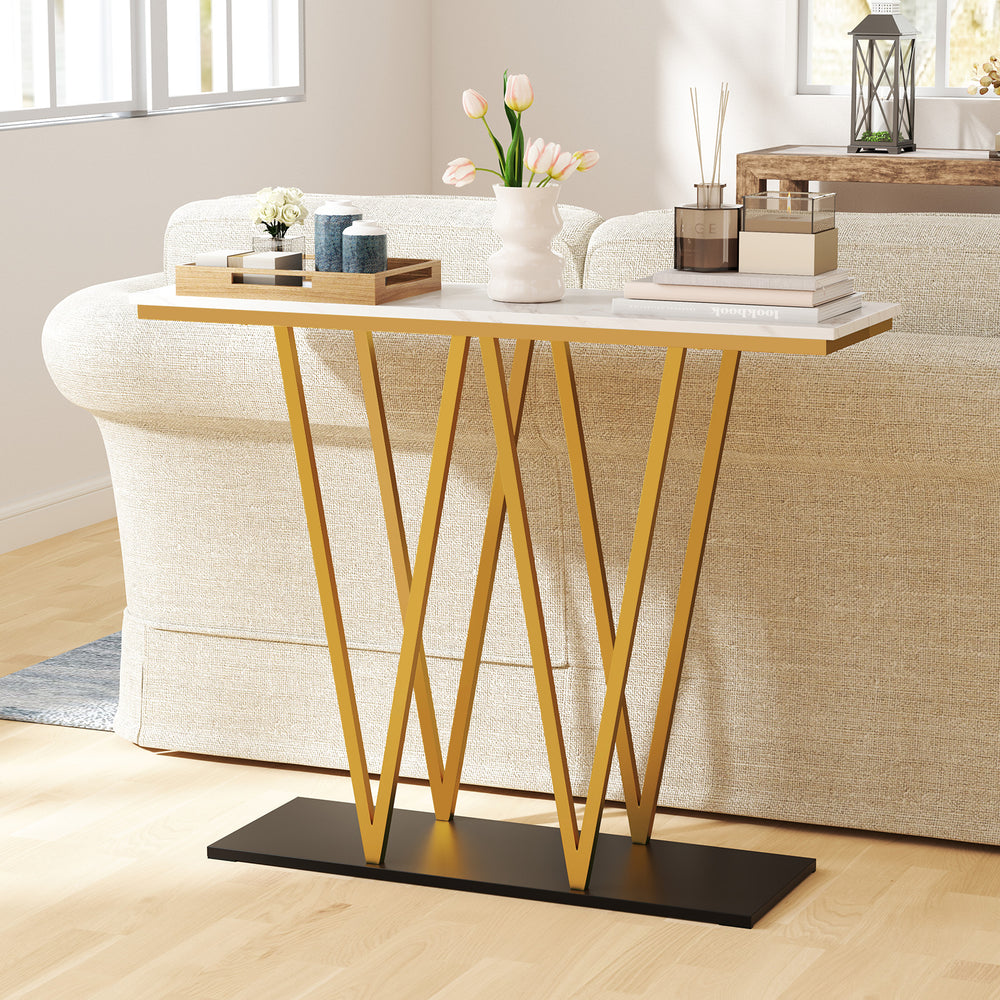 Gold entryway table with faux marble surface and a sleek W-shaped frame, ideal for contemporary decor and tight spaces.
