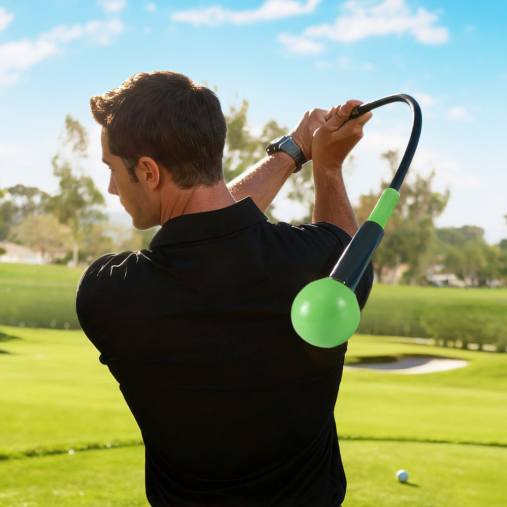Golf swing trainer aid with weighted head, fiberglass shaft, and ergonomic handle for practice and warm-up on the.