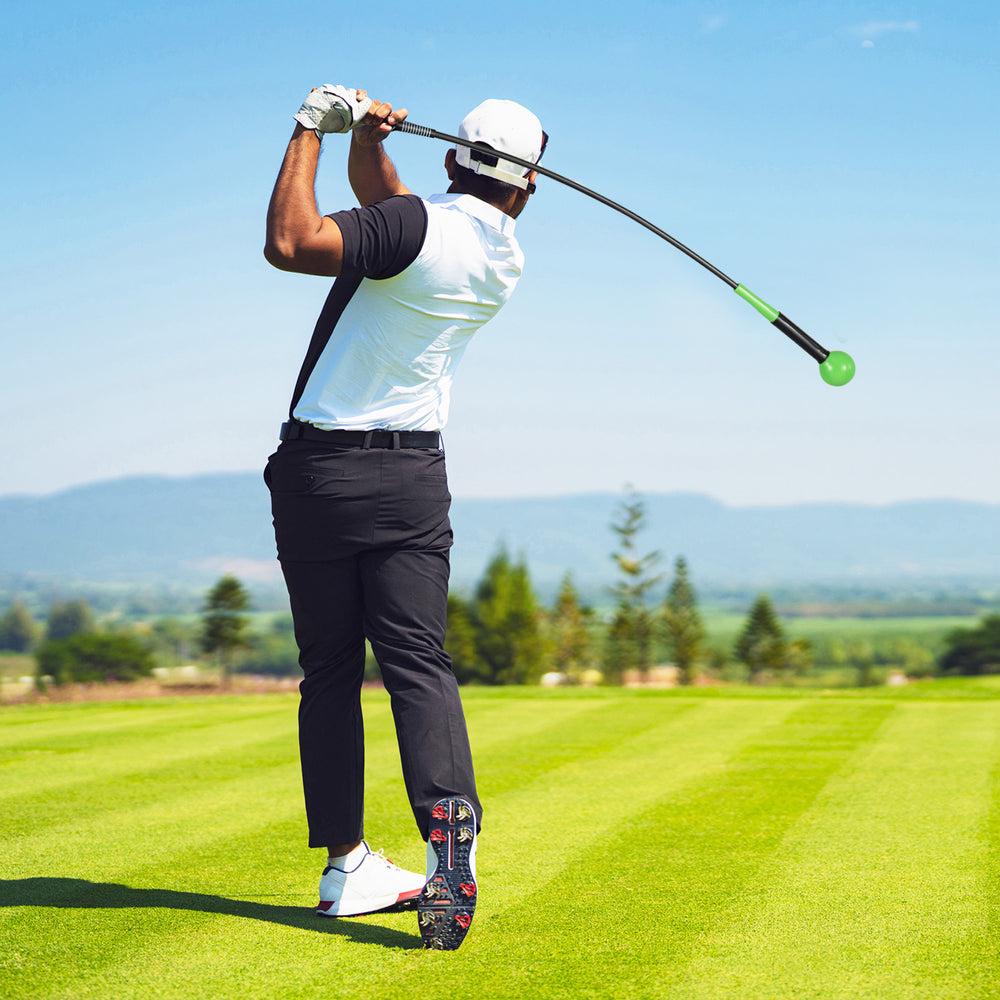 Golf Swing Trainer Aid with weighted head, fiberglass shaft, and ergonomic handle for warm-up and practice on the.