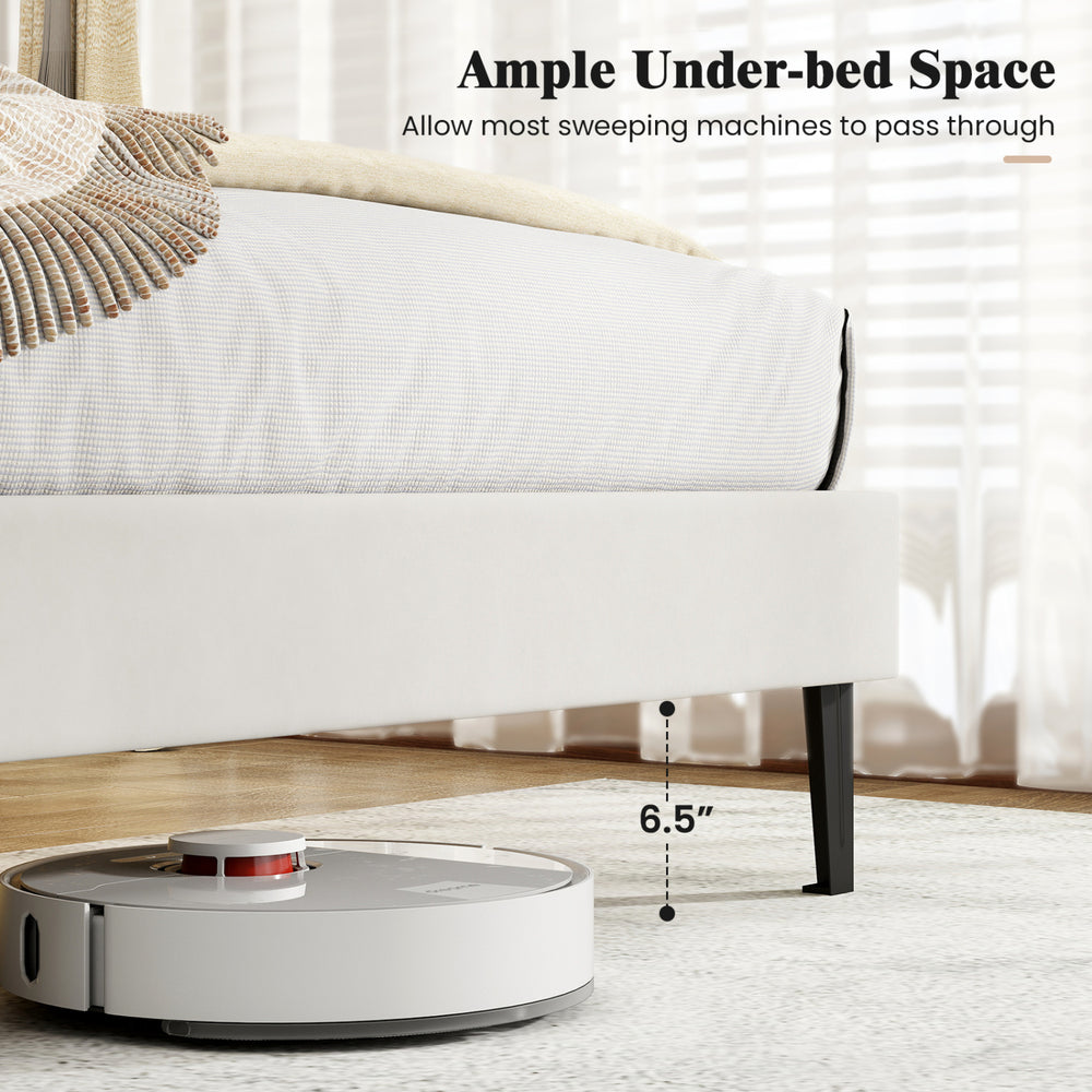 Gray linen upholstered platform bed with adjustable headboard and ample under-bed space for sweeping machines.