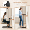 Adjustable height gray overbed rolling table with a spacious surface, ideal for meals and laptops, suitable for various.