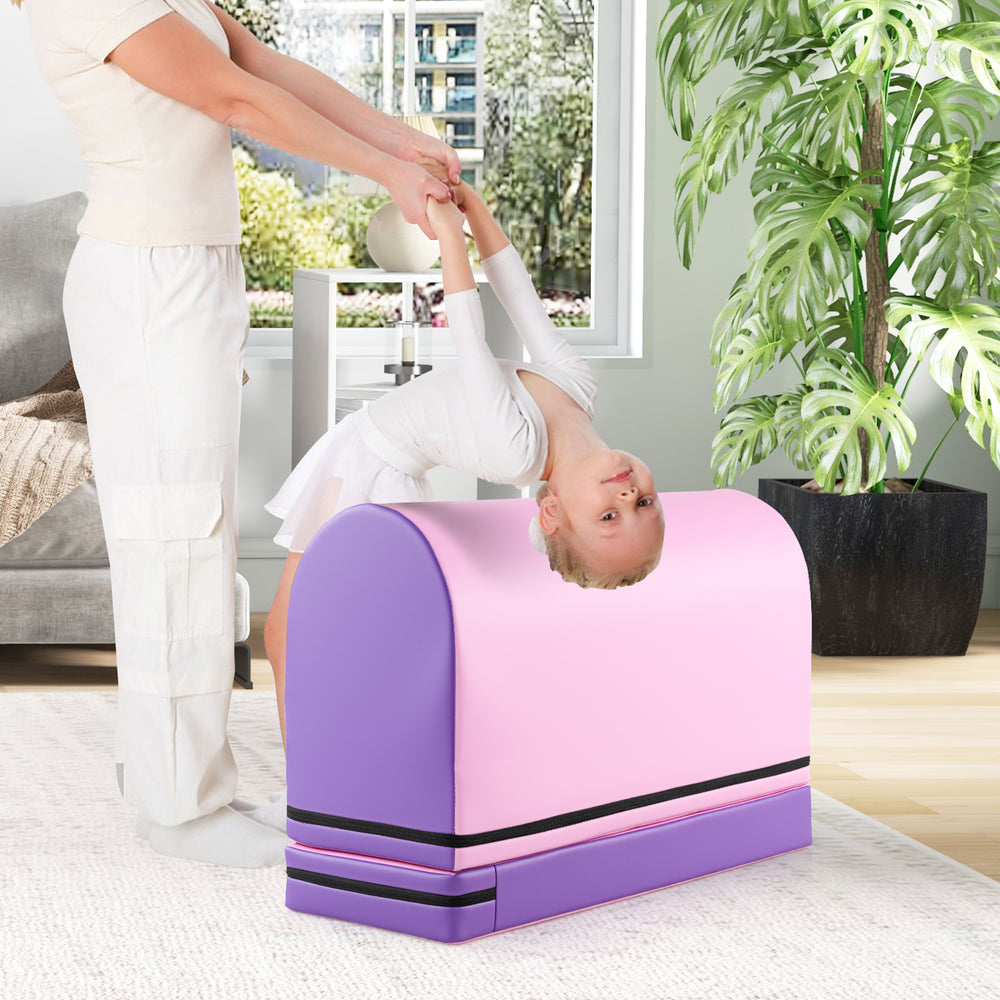 Purple gymnastics vaulting box shown in use, featuring a detachable mat and designed for versatile training for kids.
