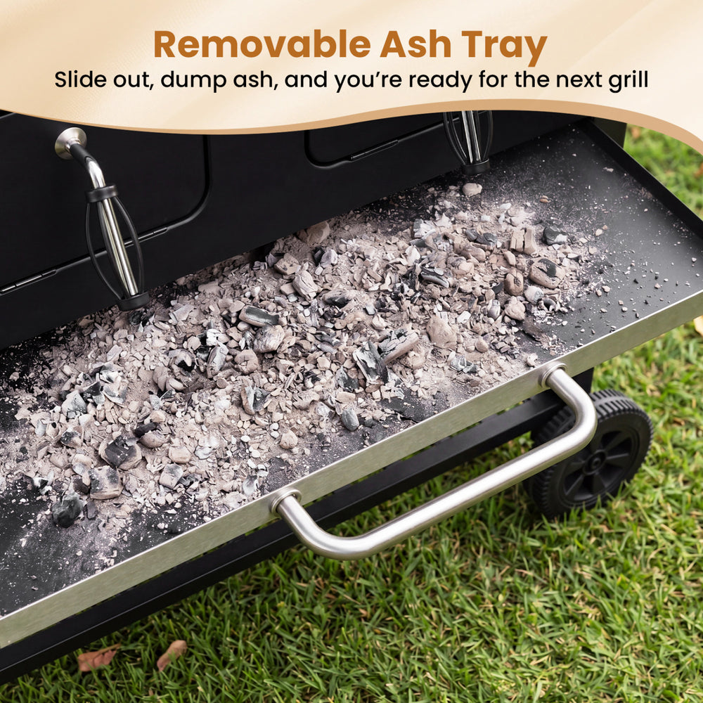 Removable ash tray of the large charcoal grill, designed for easy cleaning and maintenance after outdoor barbecues.