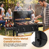 Large charcoal grill with heavy-duty metal construction, dual-zone charcoal trays, and folding tables for outdoor.