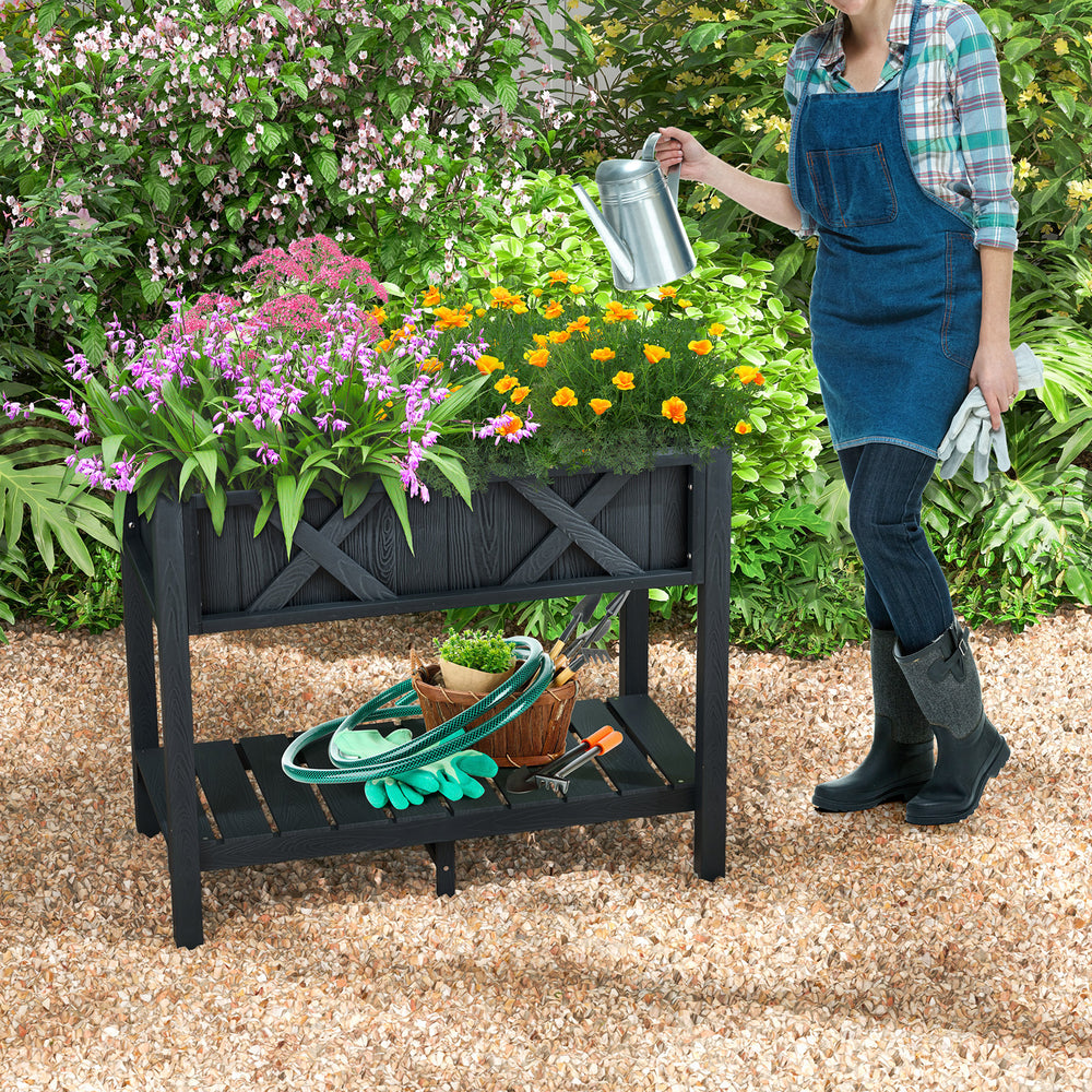 Elevated black HIPS raised garden bed with vibrant flowers, perfect for cultivating plants without bending or kneeling.