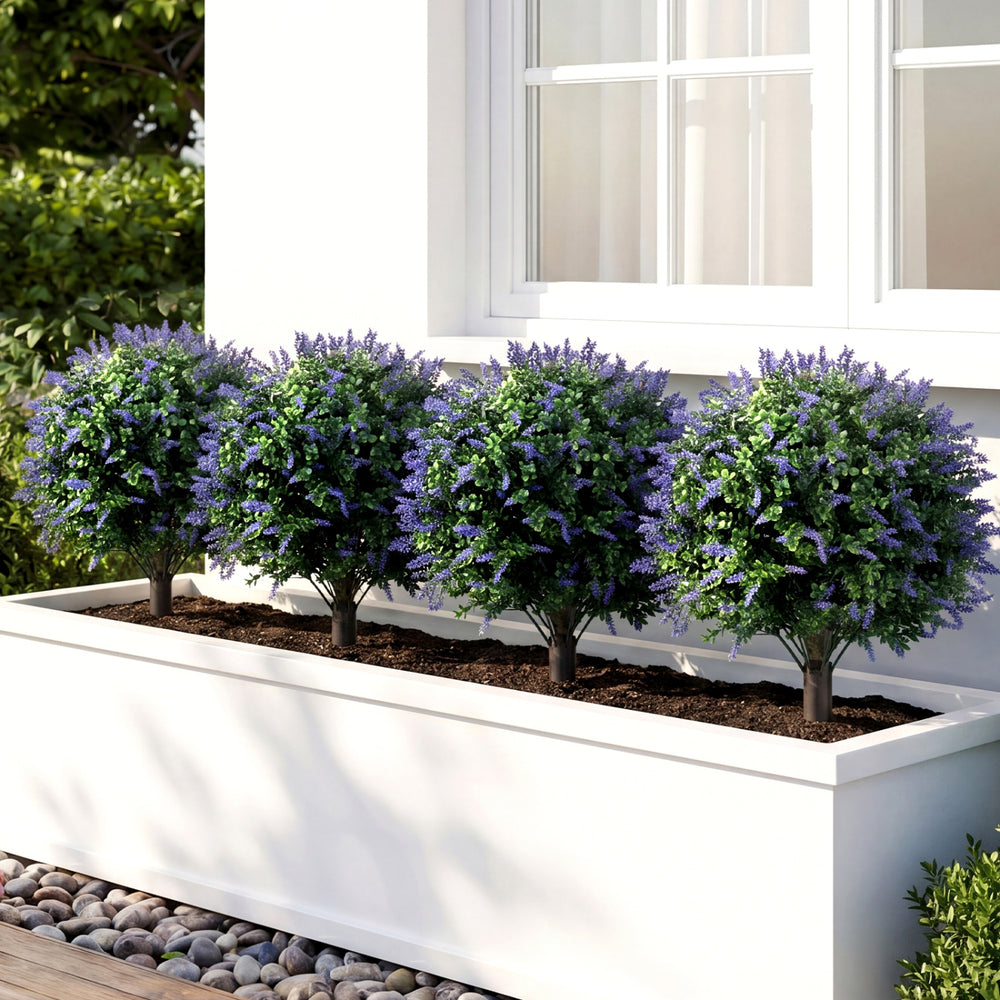 Four artificial lavender boxwood topiary ball trees in a planter, featuring purple flowers and realistic trunks for.