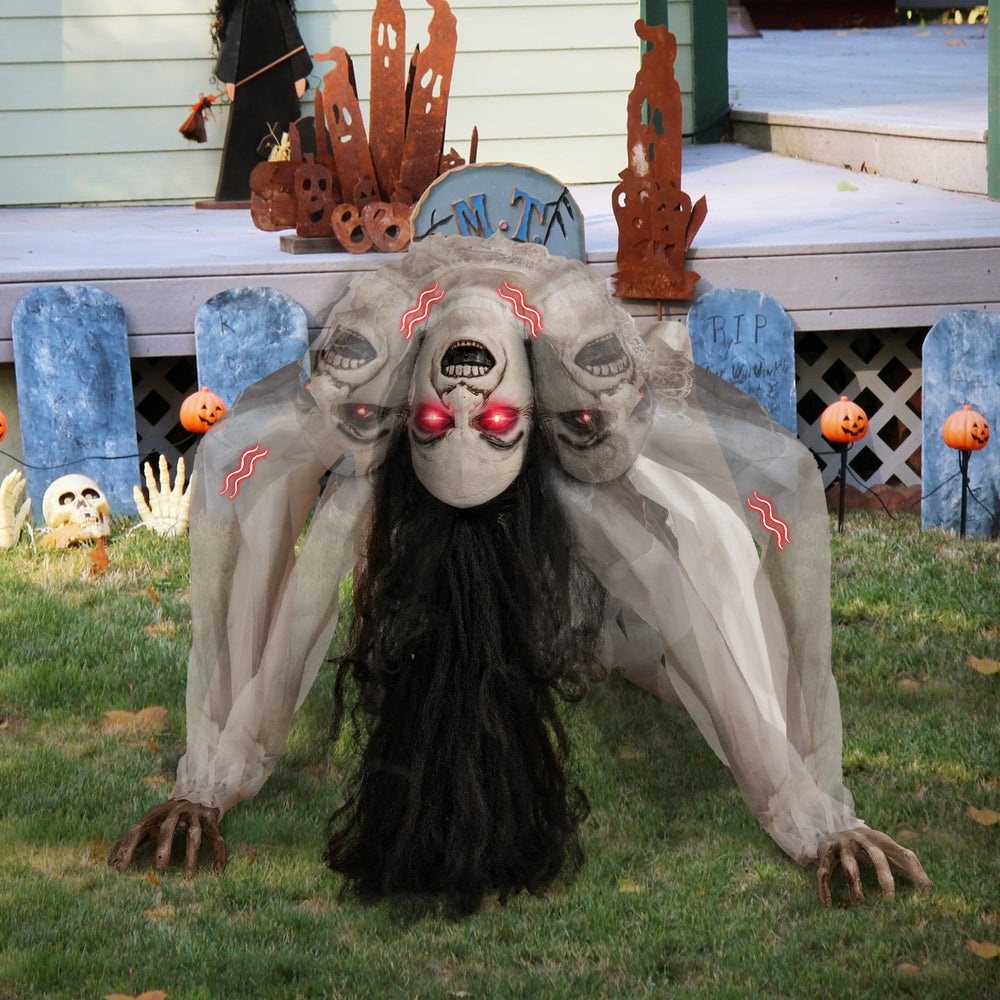 Crawling woman ghost animatronic with LED eyes, sound effects, and durable polyester fabric for Halloween decoration.