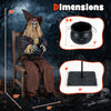 Eerie Halloween animatronic sitting scarecrow with glowing red eyes and cauldron-shaped candy bowl for trick-or-treaters.
