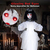 Halloween doll girl with glowing red eyes, shakeable head, and posable arms for spooky Halloween decorations.
