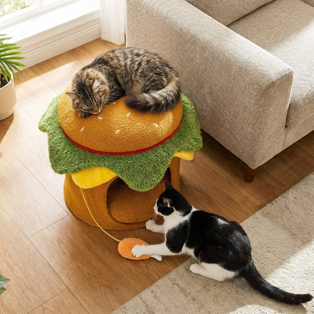 Hamburger-shaped cat nest with removable cushion and plush chicken drumstick toy, perfect for indoor relaxation.
