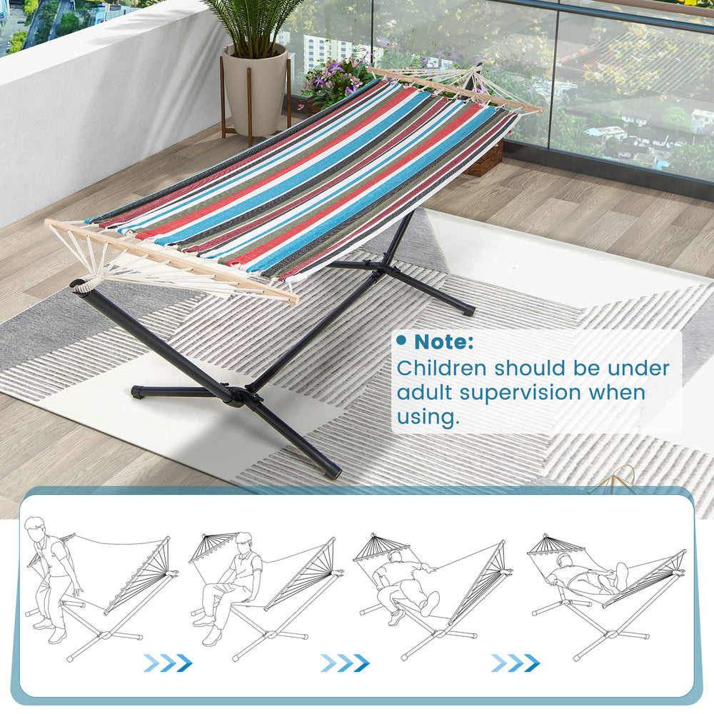 Multicolor hammock with stand, featuring breathable fabric and sturdy metal frame, ideal for garden or patio relaxation.