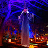 Life-size animated witch decoration with glowing red eyes and posable arms, perfect for Halloween parties and outdoor.