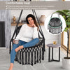 Hanging hammock chair with soft cushions, sturdy rope chain, and elegant tassels, perfect for indoor and outdoor.