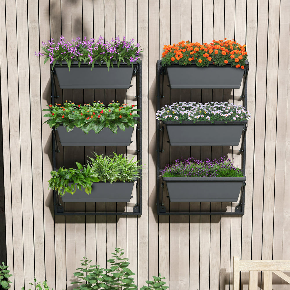 Hanging vertical planter with three detachable black boxes, adjustable height, mounted on a wooden wall for.