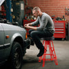Heavy-duty aluminum garage bar chair in red with a 360° swiveling seat, ideal for workbenches 41"-44" high.