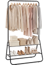 Heavy duty black clothes rack with hanging rod, two storage shelves, and various clothing and accessories displayed.