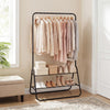 Heavy duty black clothes rack with a close-up view of the hanging rod and storage shelves for organizing clothing and.