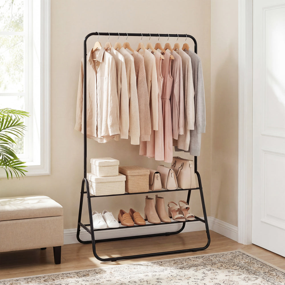 Heavy duty black clothes rack with a close-up view of the hanging rod and storage shelves for organizing clothing and.