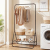 Heavy duty black clothes rack with hanging rod and two storage shelves, ideal for laundry room or bedroom organization.