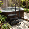 Heavy duty black hot tub stair with wide anti-slip platforms, designed for secure access and stability outdoors.