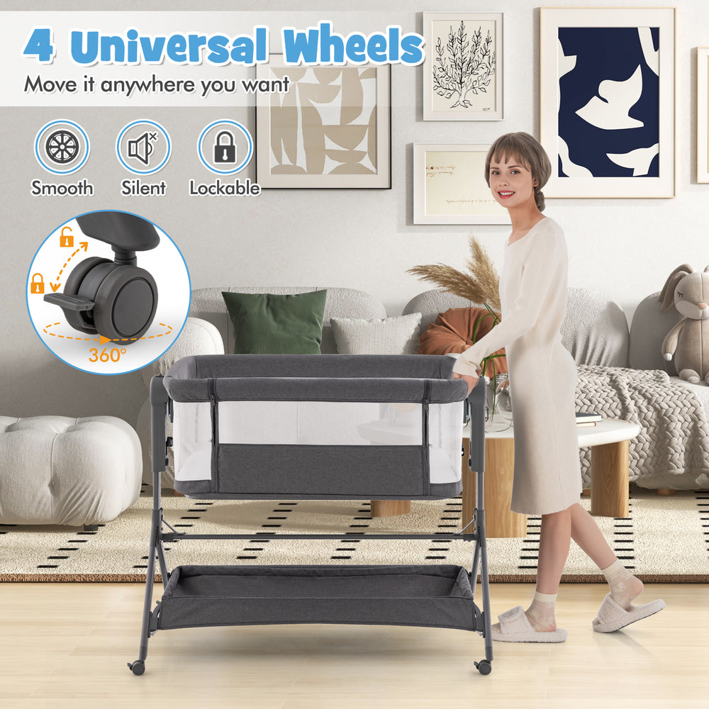 Height adjustable gray bedside sleeper with 360-degree wheels, storage bag, and soft mattress for easy baby access.
