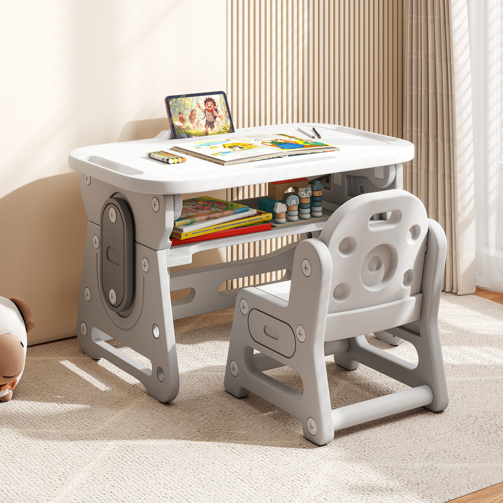 Height adjustable kids table and chair set in gray with tiltable whiteboard, perfect for studying and drawing.