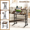 Height adjustable mobile standing desk in rustic brown features a tilting tabletop and built-in power outlets for versatile use.