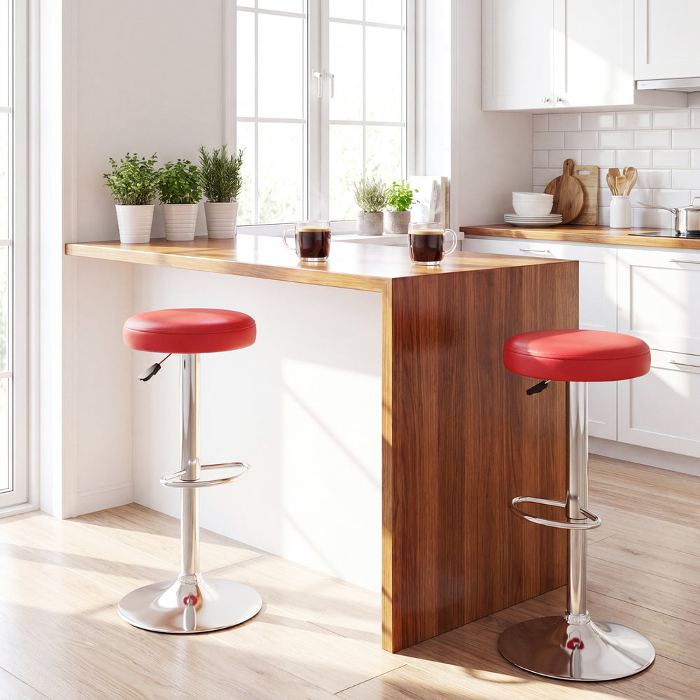 Height-adjustable red bar stool with 360° swivel, soft PU leather, and sturdy metal frame for kitchen or dining use.