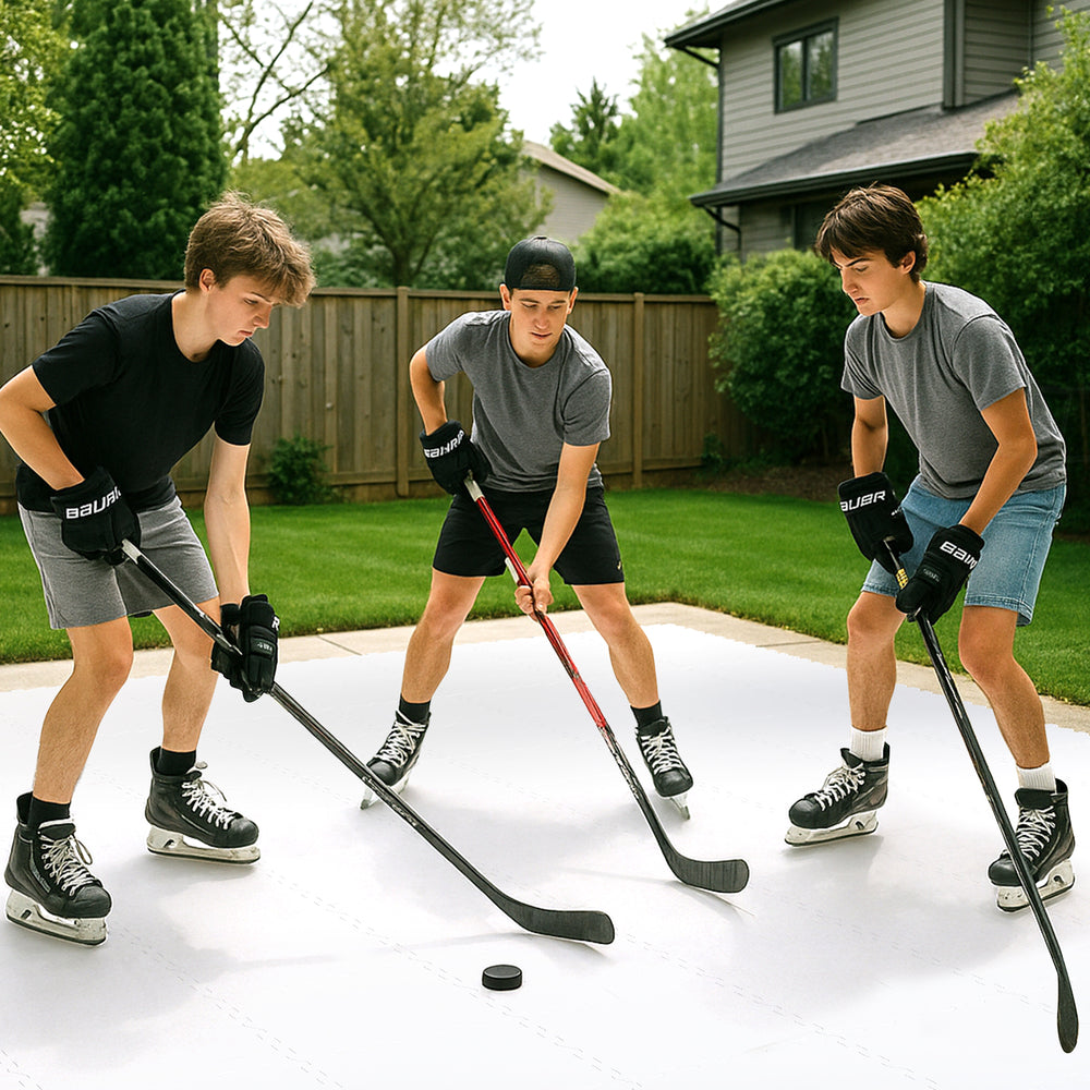 Three young players practicing hockey on synthetic ice tiles, showcasing realistic puck handling and shooting skills.