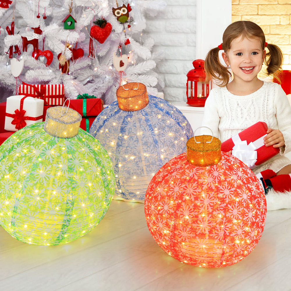 Colorful 3-piece pre-lit Christmas ball set with warm white LED lights, featuring snowflake patterns for festive decor.