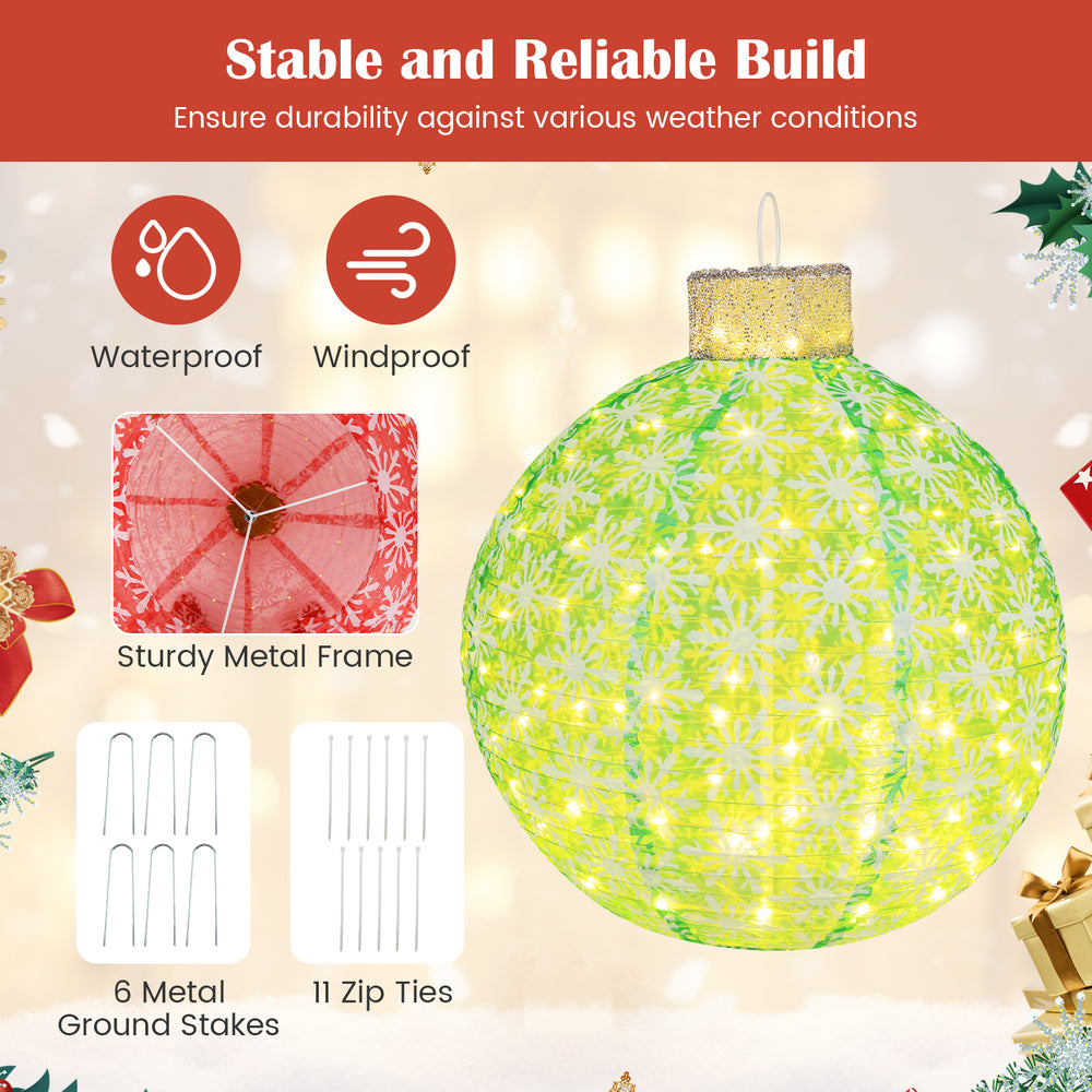 Pre-lit green Christmas ball with snowflake patterns and warm white LED lights, ideal for indoor and outdoor festive.