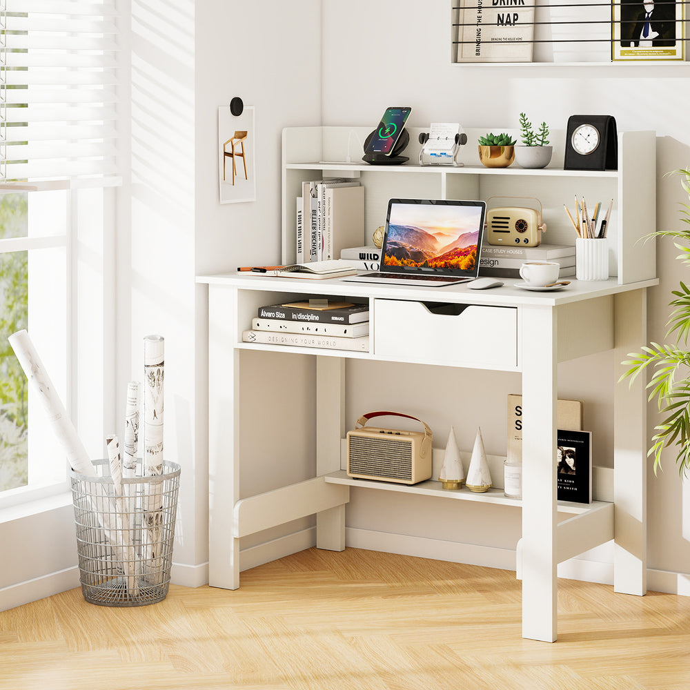 Home office computer desk with storage shelves, drawer, and built-in AC outlet for organized working and studying.