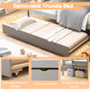 Gray removable trundle bed with smooth wheels, cut-out handles, and space-saving design for versatile sleeping.