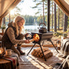 Hot tent stove with chimney pipes, carbon steel construction, and foldable legs for outdoor heating and cooking.