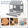 Twin size gray wooden house bed frame with trundle, featuring a tall roof and safe surrounding fence rails for kids.