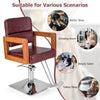 Hydraulic barber chair with red PVC leather, 360-degree swivel, and adjustable height for versatile salon use.