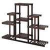 Multi-tiered brown wood plant stand with slatted shelves, designed for indoor and outdoor use, holds up to 9 potted.