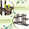 Multi-tiered brown wood plant stand with slatted shelves for ventilation, ideal for indoor and outdoor use.