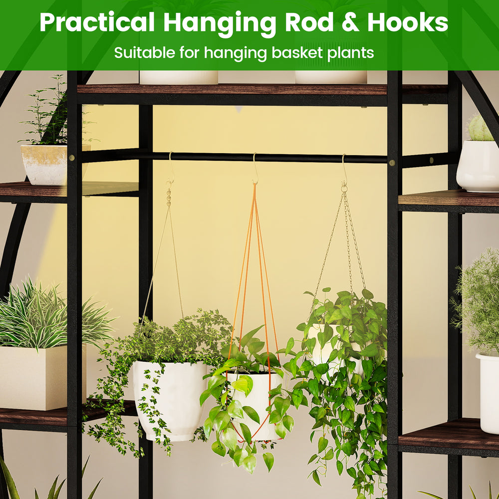 Hanging rod and hooks on the 63" tall indoor plant stand, perfect for displaying basket plants in a stylish corner.