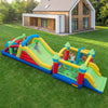 Colorful inflatable bounce house with slide, climbing wall, and tunnels for kids' outdoor fun and active play.
