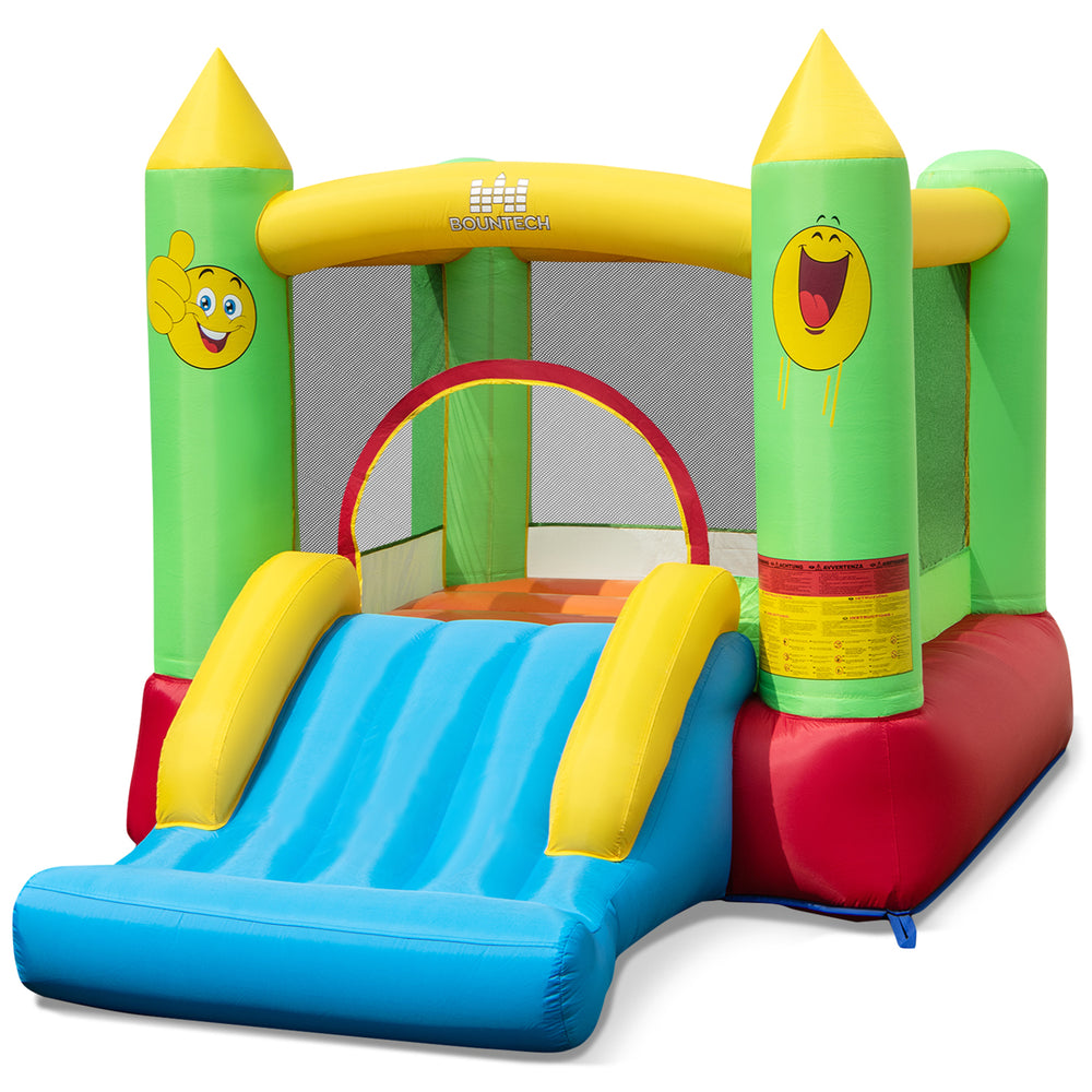 Wide slide entrance of the inflatable bounce house for kids, featuring a durable design and vibrant smiley face theme.