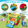 Kids enjoying the inflatable bounce house with slide, featuring a vibrant smiley face design for outdoor fun and play.