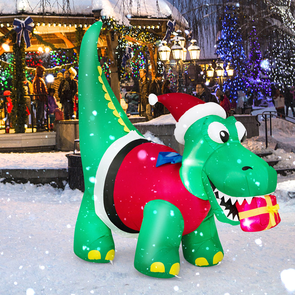 Inflatable dinosaur Christmas decoration with LED lights, wearing a Santa hat and holding a gift box for festive.