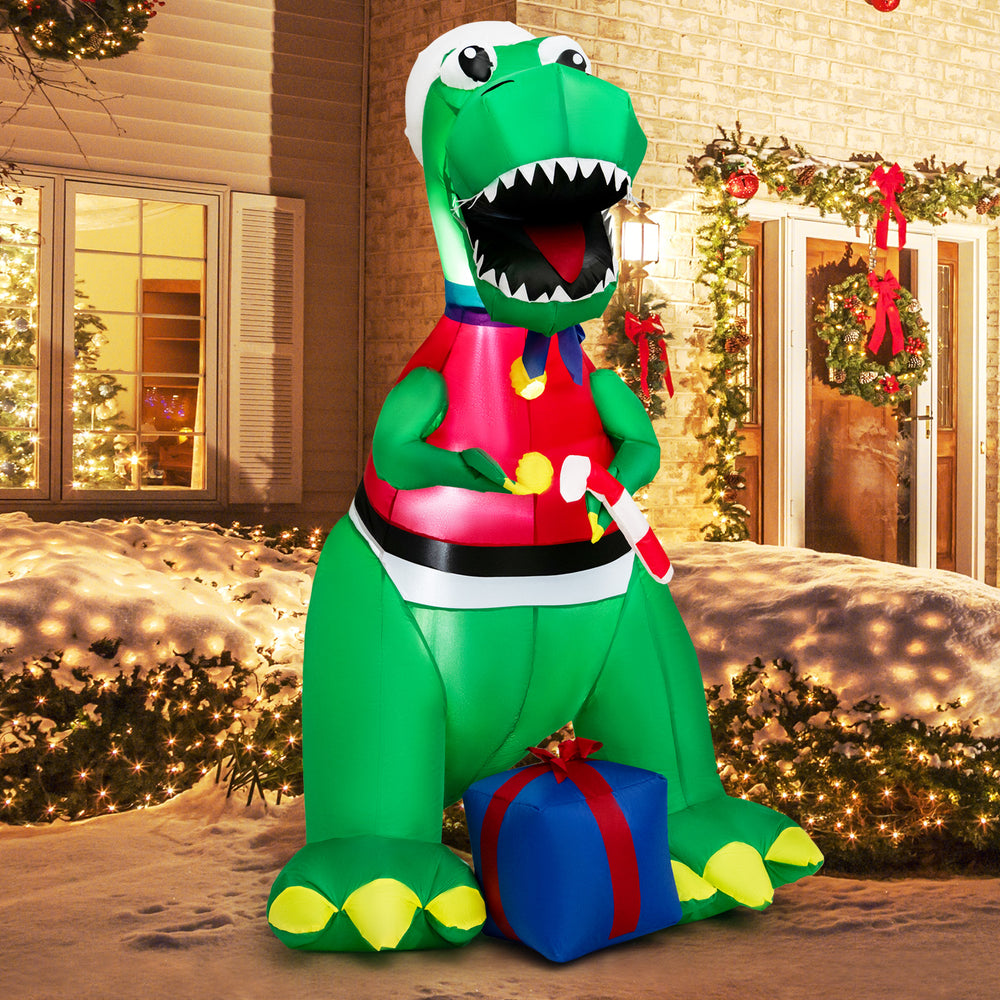 Inflatable 6FT dinosaur Christmas decoration holding a candy cane and gift box, perfect for festive yard displays.