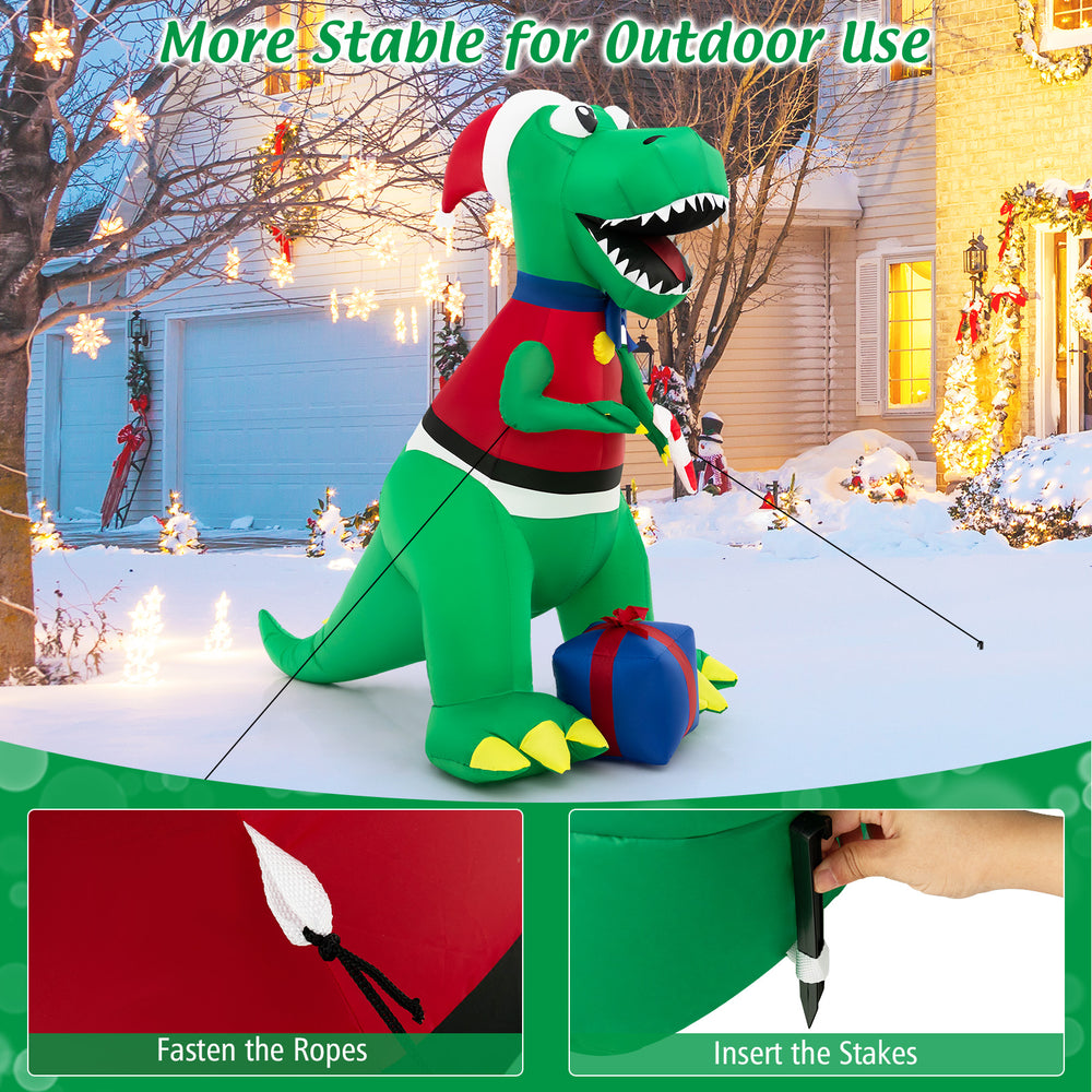6FT inflatable dinosaur Christmas decoration with LED lights, hat, and gift boxes for festive outdoor display.