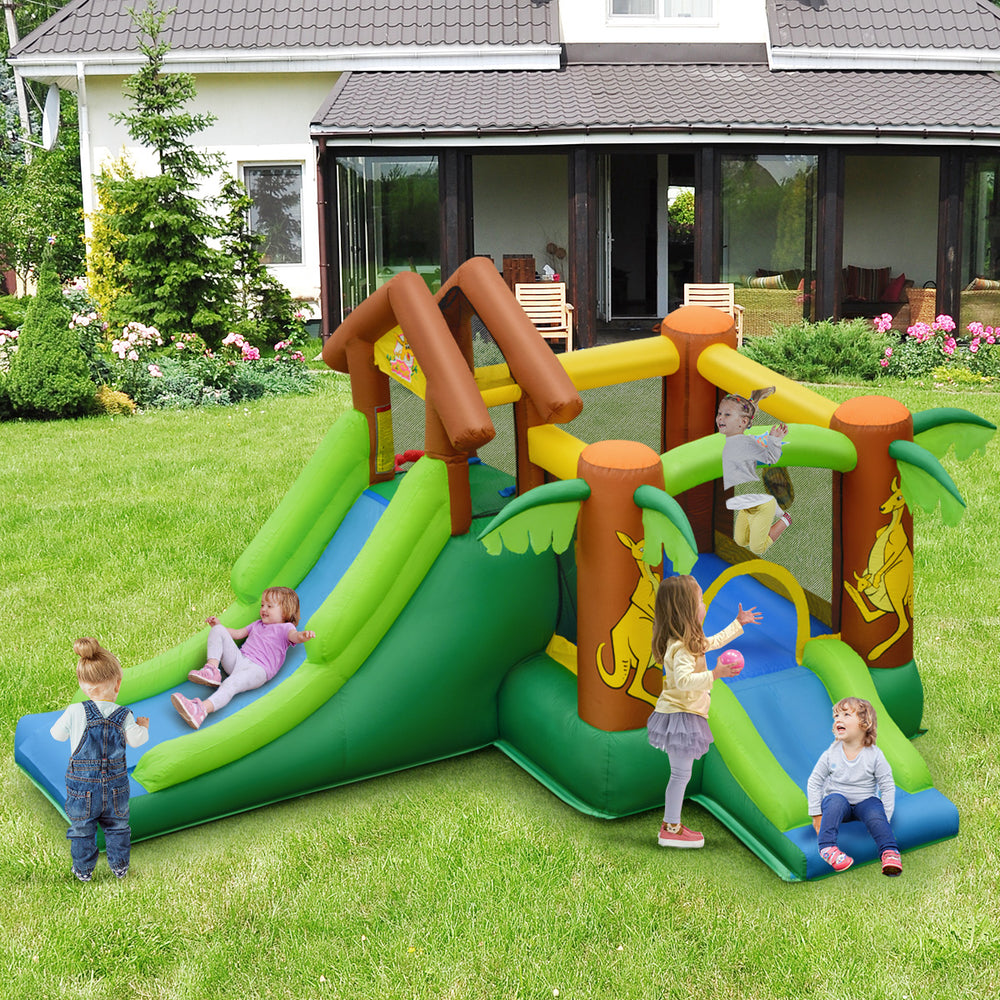 Kids inflatable jungle bounce house showing slides and climbing wall for active play, made from durable PVC fabric for.